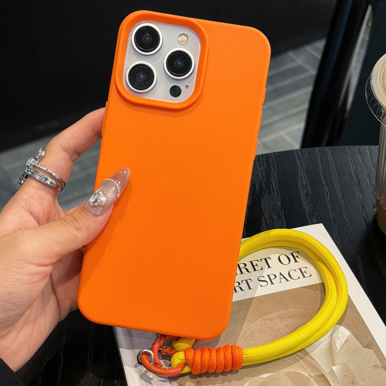 For iPhone 16 Pro Leather Texture TPU Full Coverage Phone Case with Lanyard(Orange) - Shopkiz.com