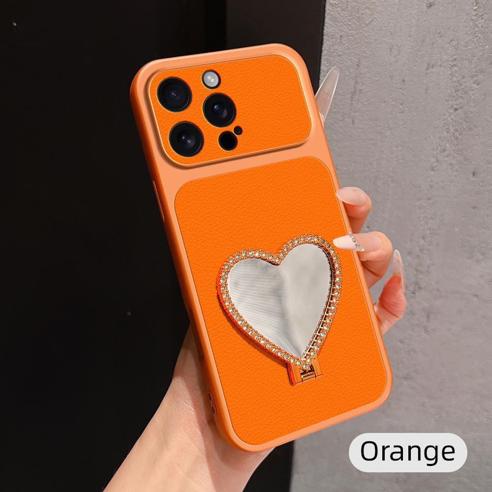 For iPhone 16 Pro Max Lambskin Series Skin Feel Shockproof Phone Case with Heart Mirror Holder(Orange) - Shopkiz.com