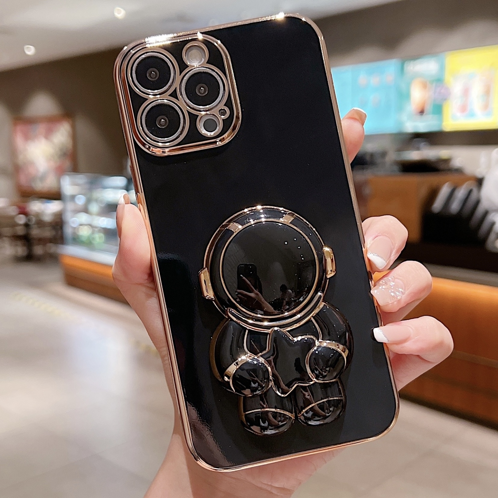 For iPhone 14 Pro Max Embrace Stars Electroplating Astronaut Holder Phone Case(Black) - Shopkiz.com