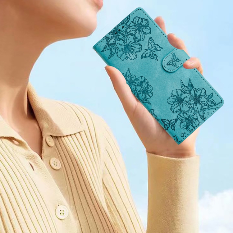 For iPhone 15 Plus Cherry Blossom Butterfly Skin Feel Embossed PU Phone Case(Green)