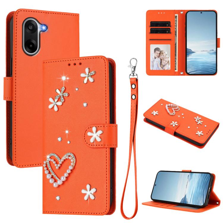

For OnePlus Nord CE5 / Ace 5 Racing ZS01 Double-Layer Heart Floral Vegan Leather Phone Case with Wrist Strap(Orange)