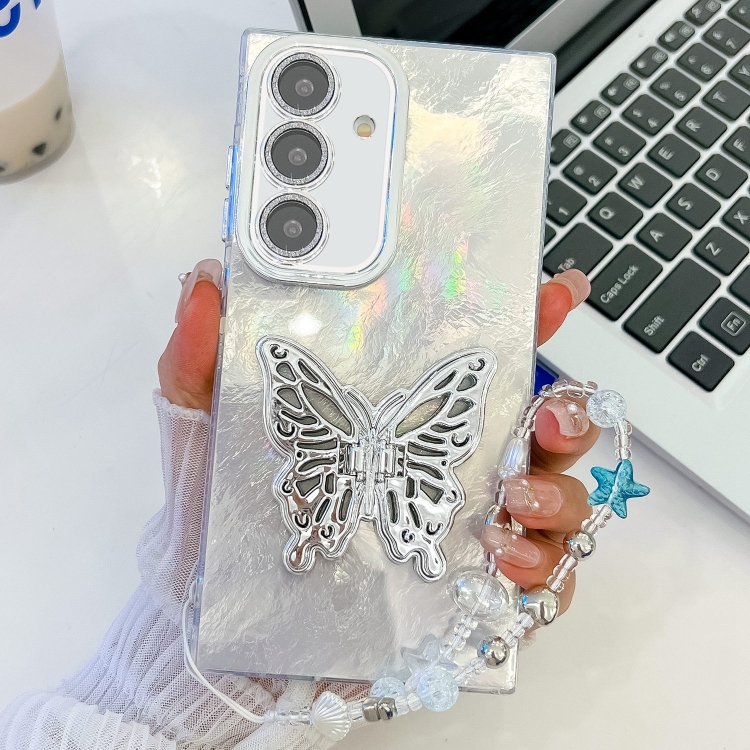 

For Samsung Galaxy S24 FE 5G Plating Glitter Lens Film Texture Butterfly Holder Wristband Phone Case(White Tinfoil Texture)