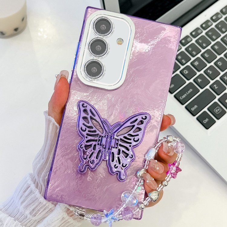 

For Samsung Galaxy A25 5G Plating Glitter Lens Film Texture Butterfly Holder Wristband Phone Case(Purple Tinfoil Texture)
