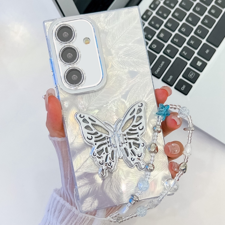 

For Samsung Galaxy S25 5G Plating Glitter Lens Film Texture Butterfly Holder Wristband Phone Case(White Feathers)