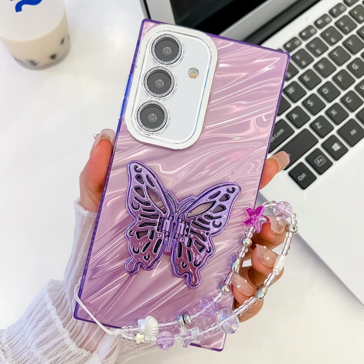 

For Samsung Galaxy S25+ 5G Plating Glitter Lens Film Texture Butterfly Holder Wristband Phone Case(Purple Water Ripples)