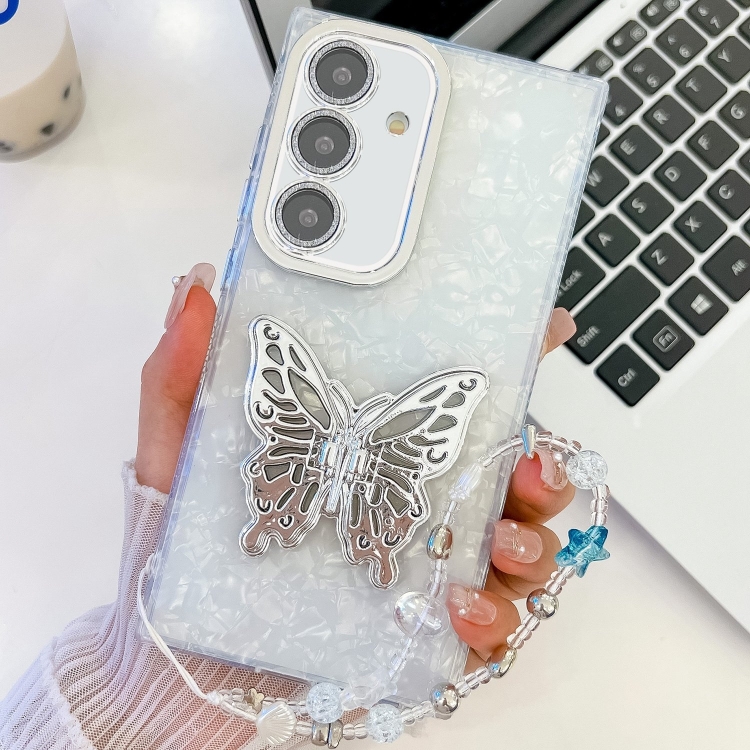 

For Samsung Galaxy S25+ 5G Plating Glitter Lens Film Texture Butterfly Holder Wristband Phone Case(White Shell Pattern)