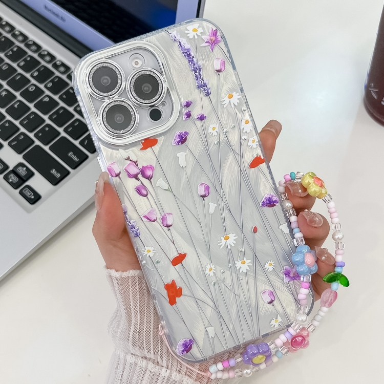 

For iPhone 15 Pro Electroplating Flower Texture Wristband TPU Phone Case(Purple Wildflowers SH1)