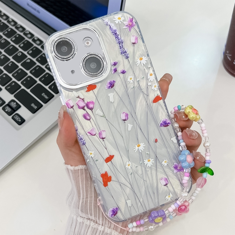 

For iPhone 15 Electroplating Flower Texture Wristband TPU Phone Case(Purple Wildflowers SH1)